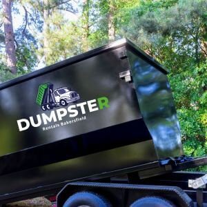 A loaded dumpster filled with building rubble from a home renovation project.